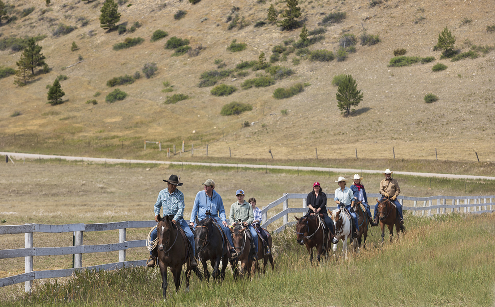 A group of horseback riders during their Montana dude ranch vacation.