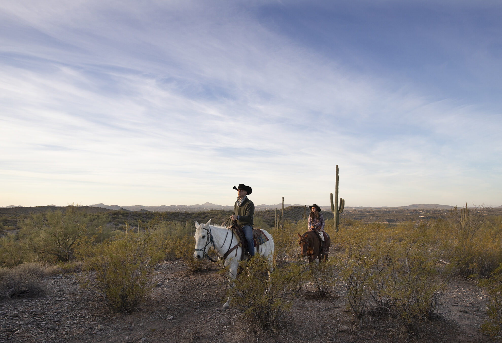 Horseback riding in the Sonoran Desert during an Arizona dude ranch vacation.